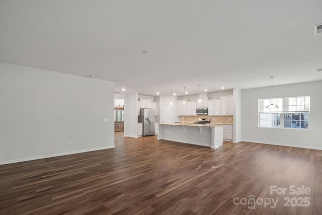 unfurnished living room featuring dark hardwood / wood-style flooring