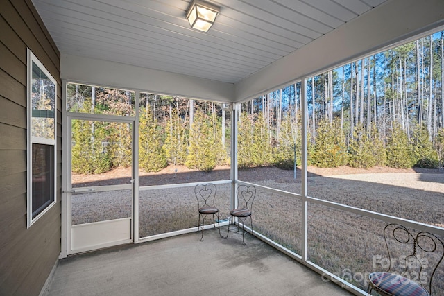 unfurnished sunroom featuring a healthy amount of sunlight