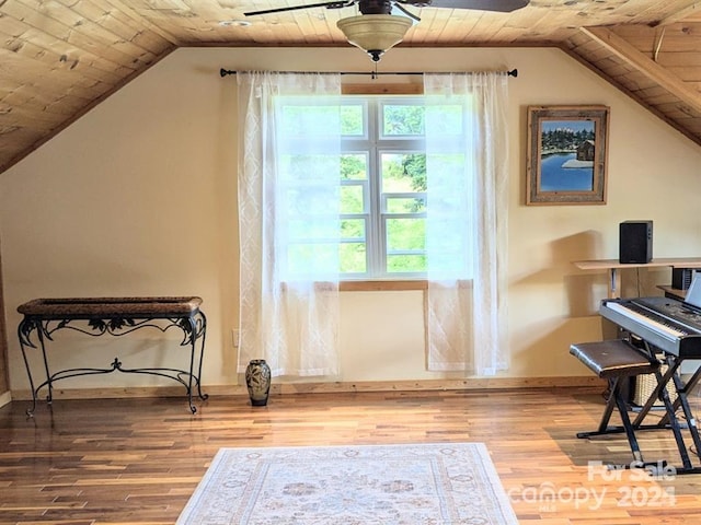 interior space featuring lofted ceiling, wood-type flooring, and wooden ceiling