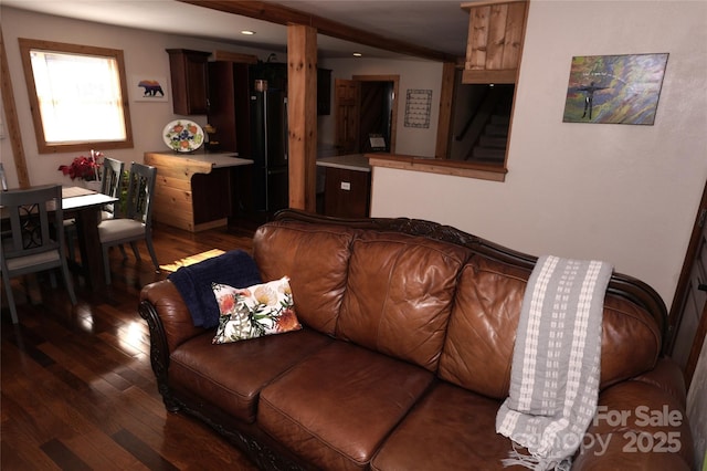 living room with dark hardwood / wood-style floors