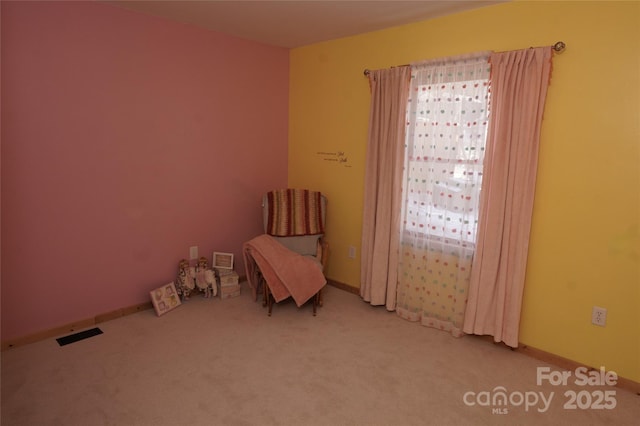 unfurnished room with light carpet