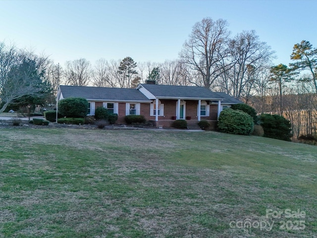 ranch-style house with a front lawn