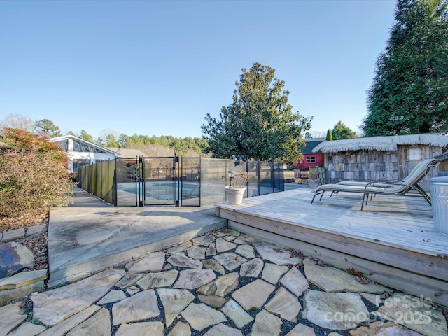 view of patio with a swimming pool side deck