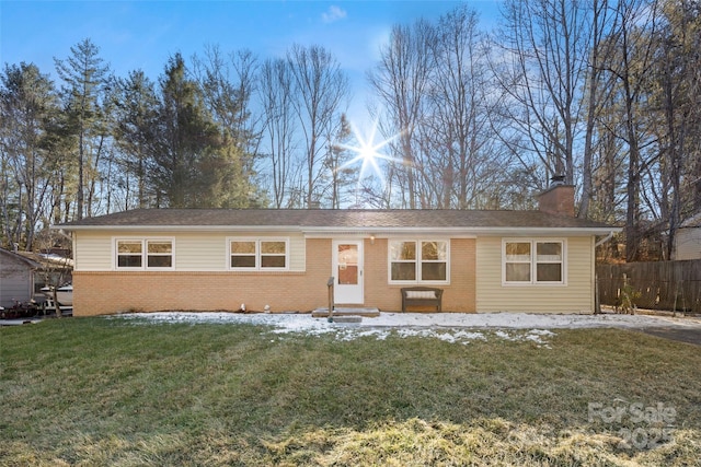 ranch-style home with a front lawn