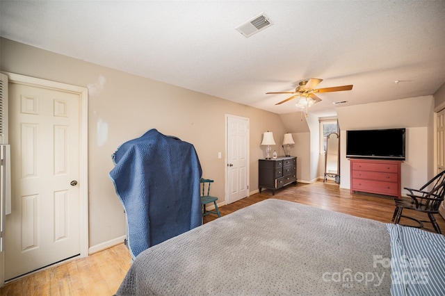 bedroom featuring hardwood / wood-style flooring and ceiling fan