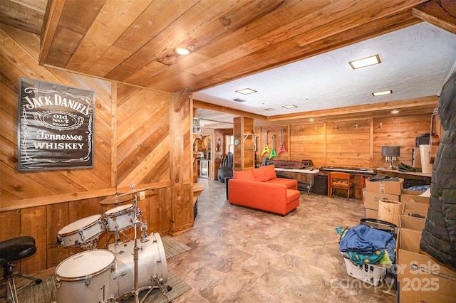 interior space featuring wooden ceiling and wooden walls