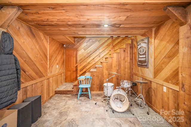 interior space with wooden ceiling and wooden walls