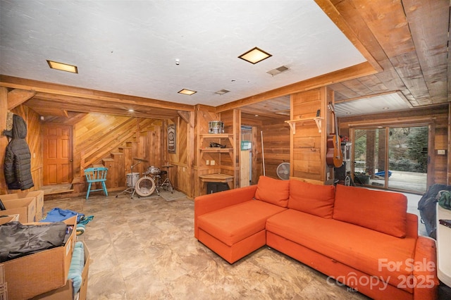 living room with wooden walls