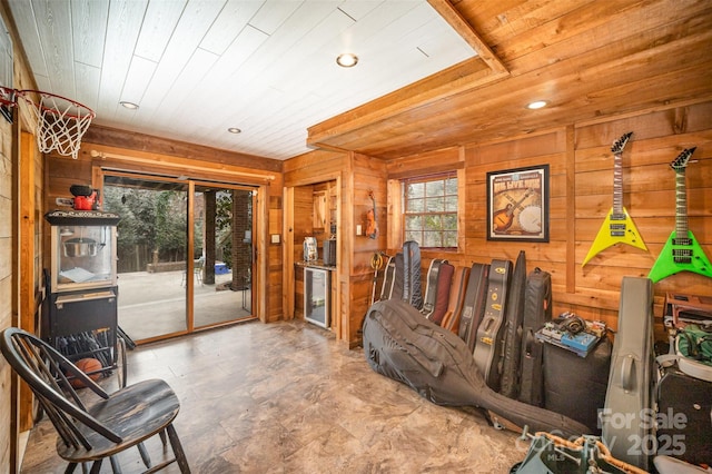 interior space featuring wood ceiling and wooden walls