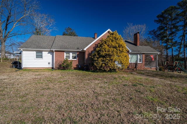 view of front of property with a front yard and a porch