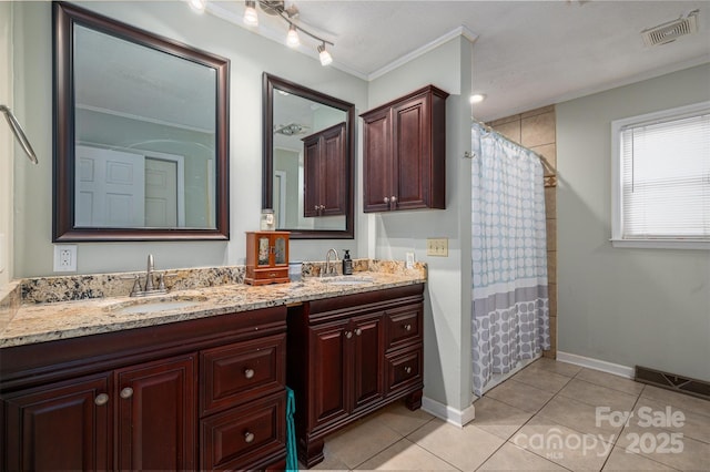 bathroom with tile patterned floors, crown molding, a shower with curtain, and vanity