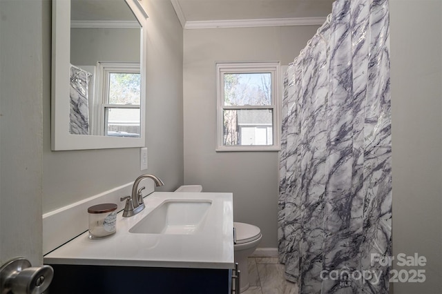 bathroom with toilet, a shower with shower curtain, a wealth of natural light, and vanity