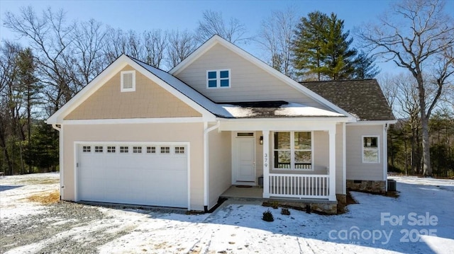 view of front of home featuring a garage and a porch