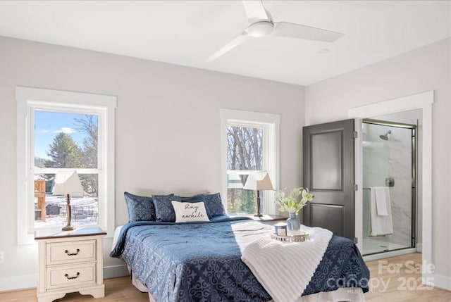 bedroom featuring multiple windows, ceiling fan, and light wood-type flooring