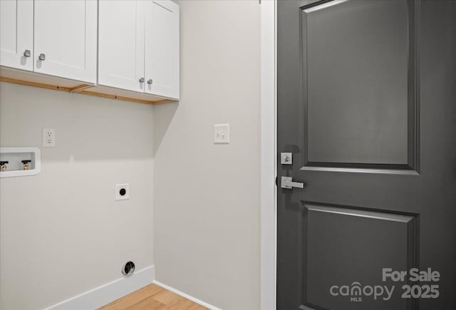 laundry area with light wood-type flooring, cabinets, hookup for an electric dryer, and washer hookup