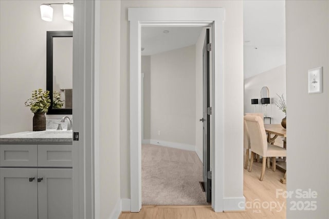 bathroom featuring vanity and hardwood / wood-style flooring