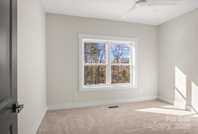 carpeted empty room with ceiling fan