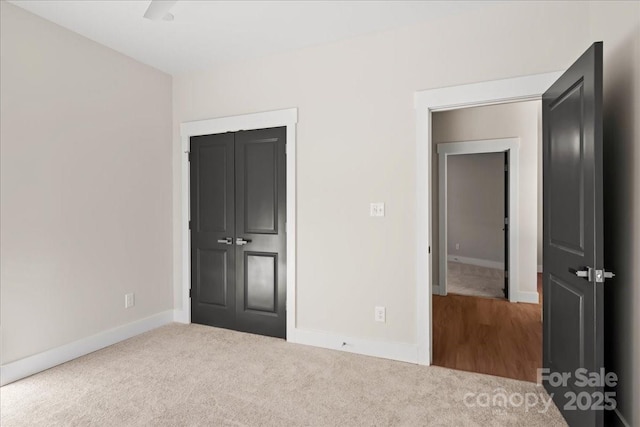 unfurnished bedroom featuring a closet and carpet