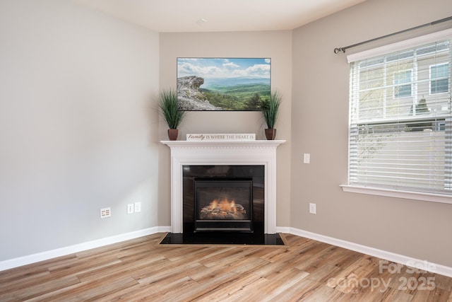 unfurnished living room with light hardwood / wood-style flooring