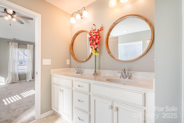 bathroom with ceiling fan and vanity