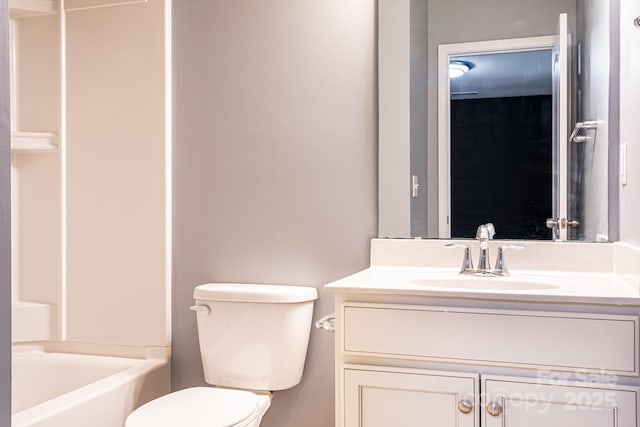 bathroom with toilet and vanity