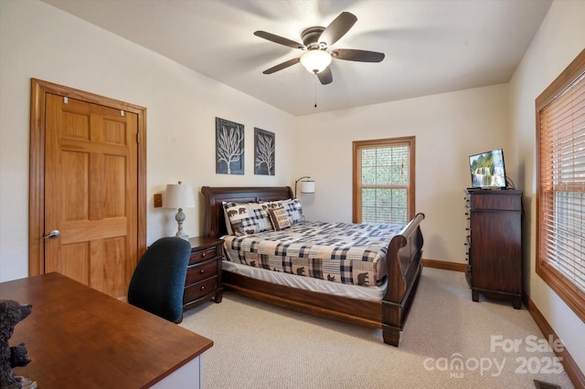 bedroom with ceiling fan and light colored carpet