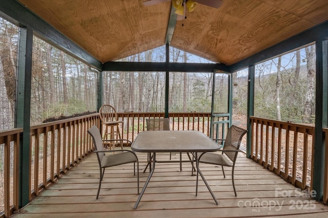 unfurnished sunroom with ceiling fan, lofted ceiling, and wood ceiling