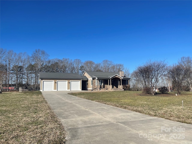 ranch-style house with a garage, covered porch, and a front yard