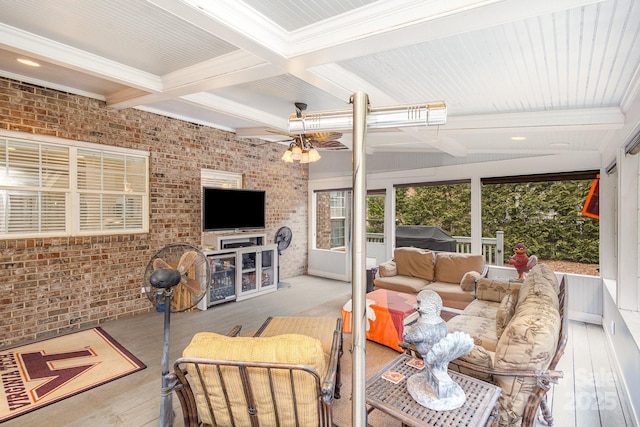 interior space with coffered ceiling, ceiling fan, and beamed ceiling