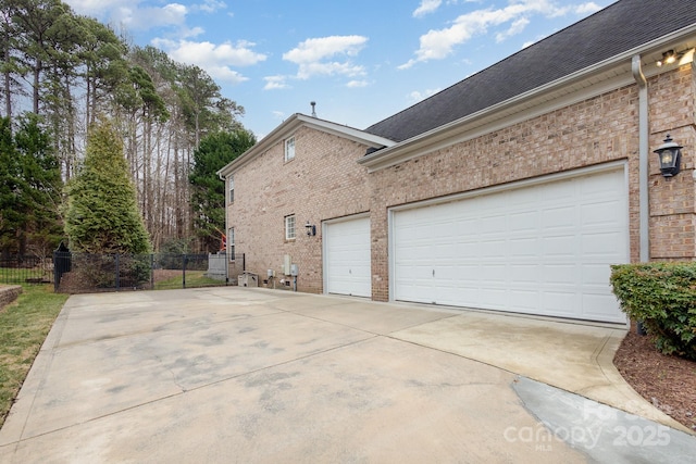 view of side of home featuring a garage