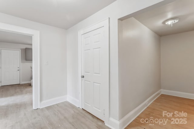 corridor featuring light hardwood / wood-style flooring