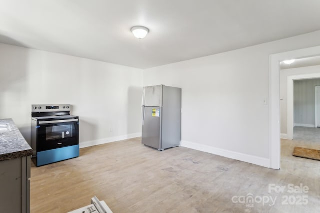 kitchen featuring stainless steel appliances and light hardwood / wood-style flooring