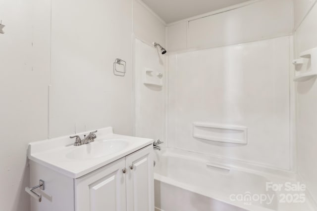 bathroom with vanity and  shower combination