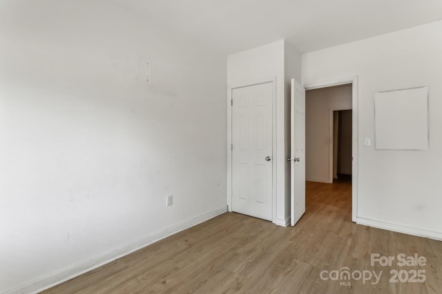 unfurnished room featuring light wood-type flooring