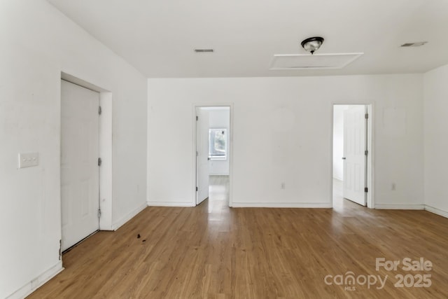 spare room featuring light hardwood / wood-style floors