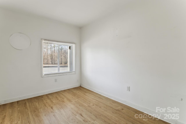 unfurnished room featuring light wood-type flooring