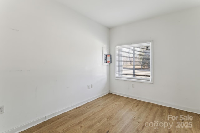 spare room with light hardwood / wood-style floors