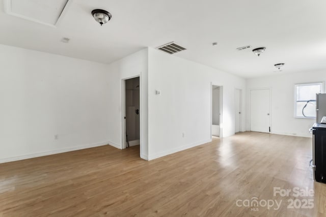 unfurnished living room with light hardwood / wood-style flooring