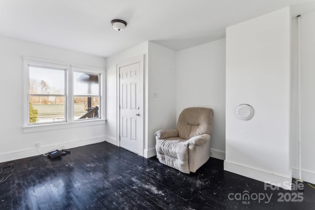 sitting room featuring dark hardwood / wood-style flooring