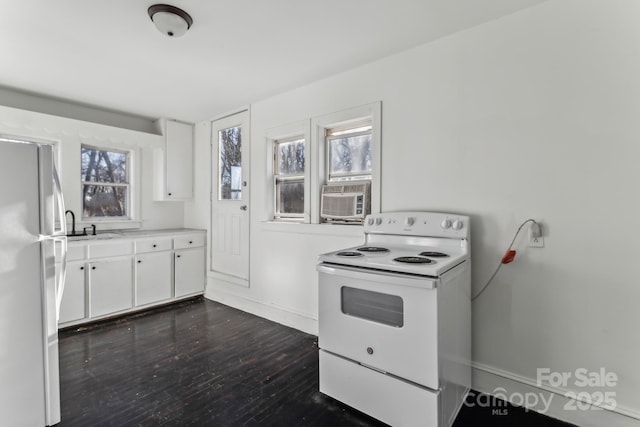 kitchen featuring dark wood-type flooring, white cabinetry, sink, and white appliances