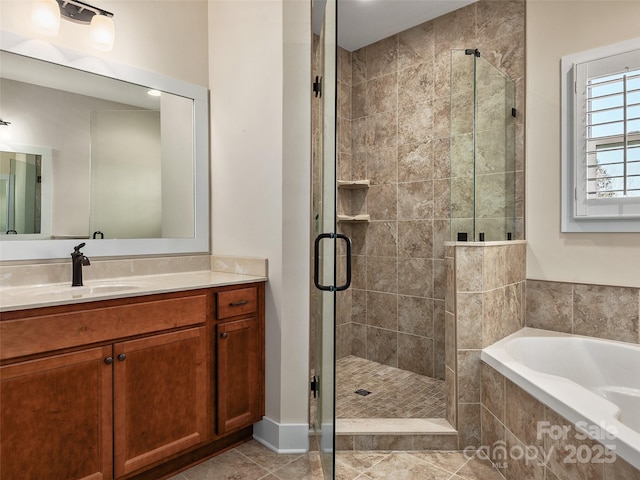 bathroom featuring tile patterned flooring, separate shower and tub, and vanity