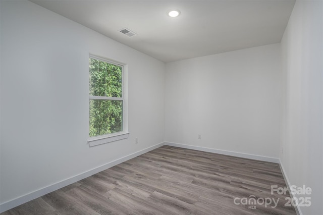 spare room with light wood-type flooring