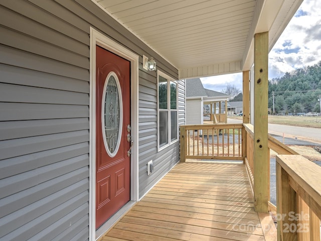 wooden deck featuring covered porch