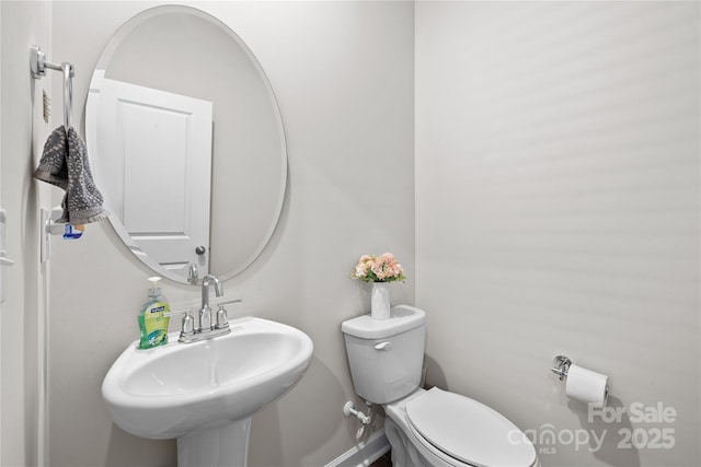 bathroom with sink and toilet