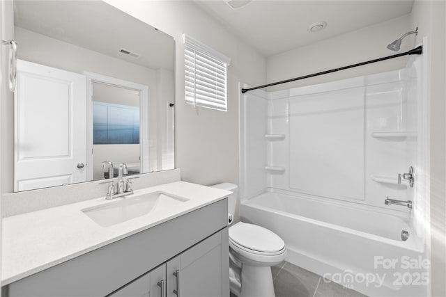 full bathroom featuring toilet, tile patterned flooring, shower / washtub combination, and vanity