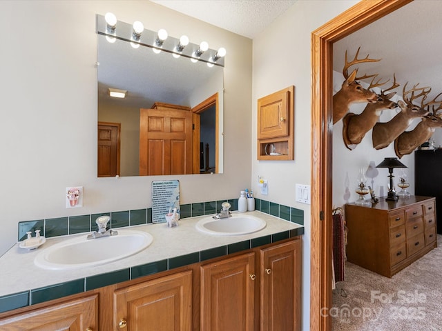 bathroom featuring vanity and a textured ceiling