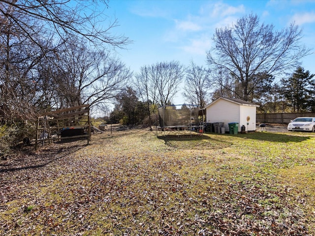 view of yard with a trampoline