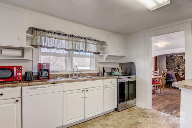 kitchen with sink, white dishwasher, white cabinetry, and electric range