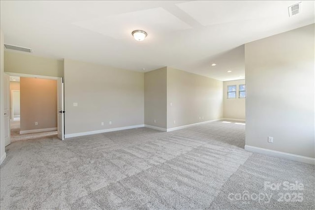 empty room with light colored carpet