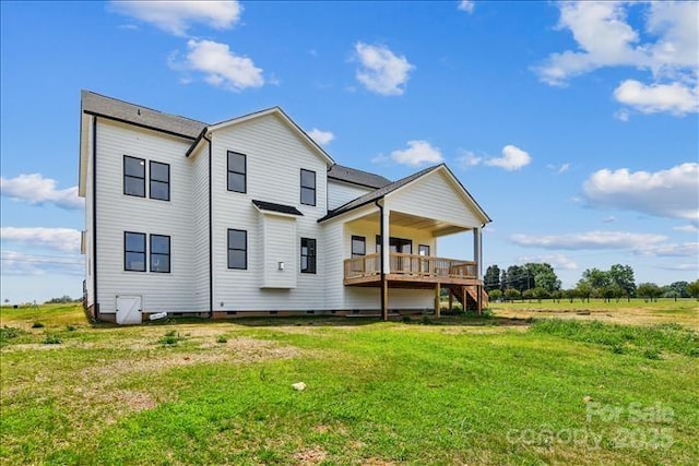 rear view of house with a yard and a rural view